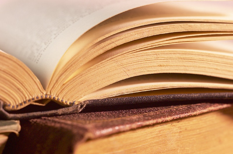 Open book on top of pile of books.jpg?ixlib=rails 2.1