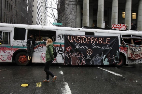 Occupy oakland fuk the police anarchist symbol banner on oo occubus 1 20 2012 2.jpg?ixlib=rails 2.1