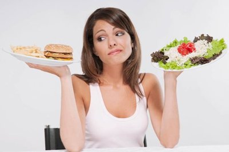 Rsz woman choosing between a hamburger plate and a salad plate.jpg?ixlib=rails 2.1