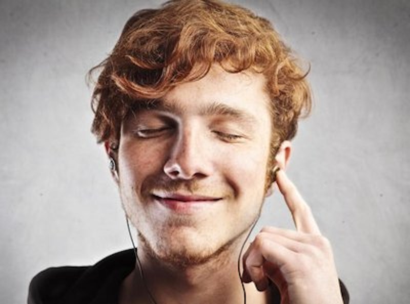 Rsz red haired man smiling while listening to music.jpg?ixlib=rails 2.1