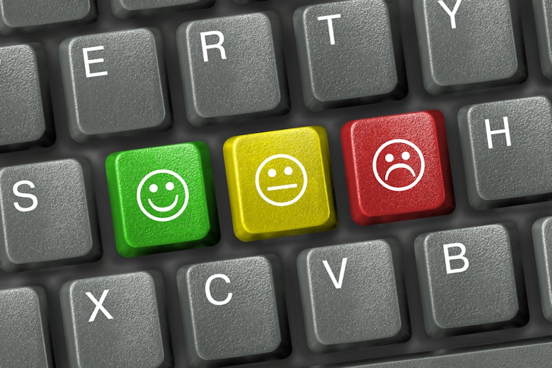 Smiley face icons on a keyboard.jpg?ixlib=rails 2.1
