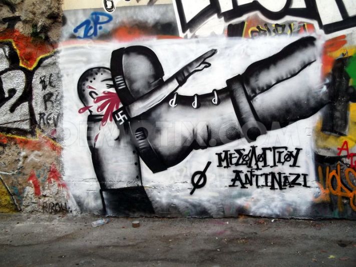 1357722422 graffiti with political messages seen in the streets of athens 1714436.jpg?ixlib=rails 2.1