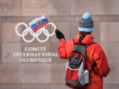 Rsz http   oaolcdncom hss storage midas af4855581db7ff0af13446252d5696a2 205923078 supporter waves a russian flag in front of the logo of the olympic picture id886266270.jpg?ixlib=rails 2.1