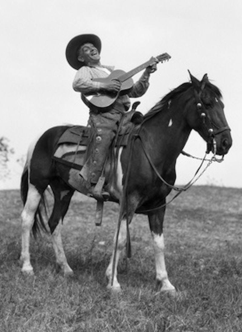 Owdr 1920s cowboy on horse singing and playing guitar.jpg?ixlib=rails 2.1