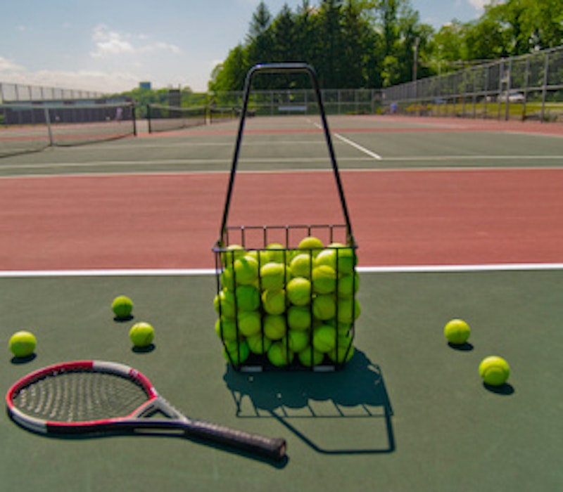 Court racquet and basket of balls src img getty.jpg?ixlib=rails 2.1