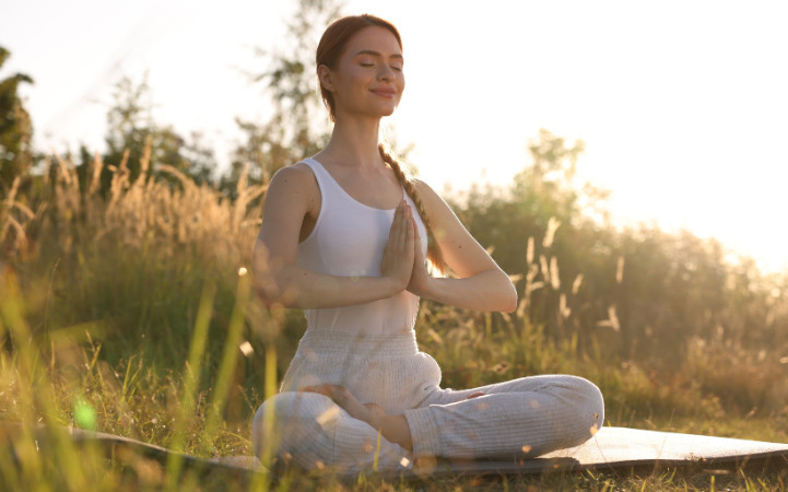 Woman practicing lotus pose padmasana.jpg?ixlib=rails 2.1